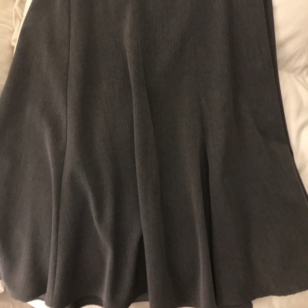 Grey mid length full skirt.
